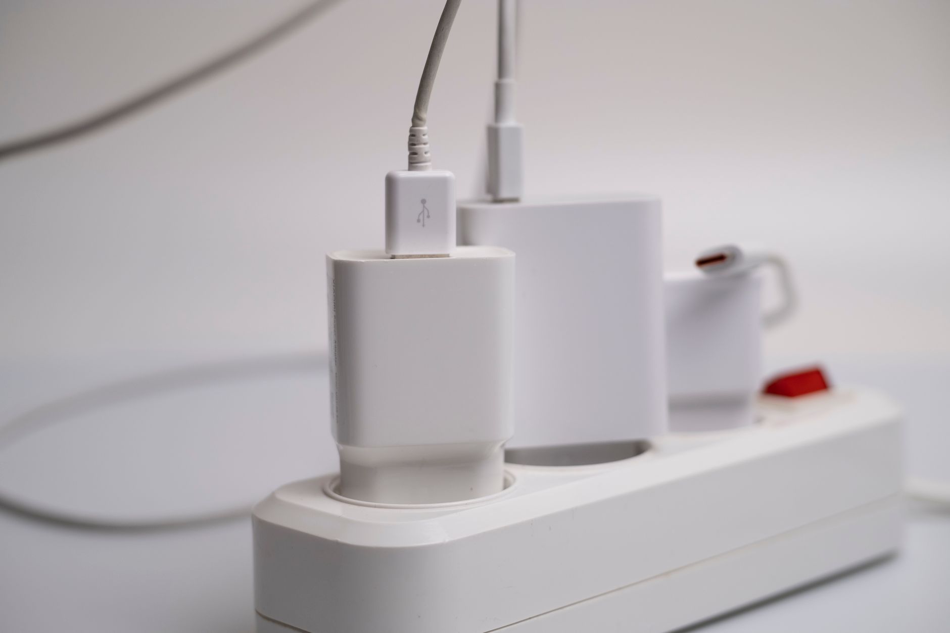 a portable power station powering a lamp and phone inside a living room