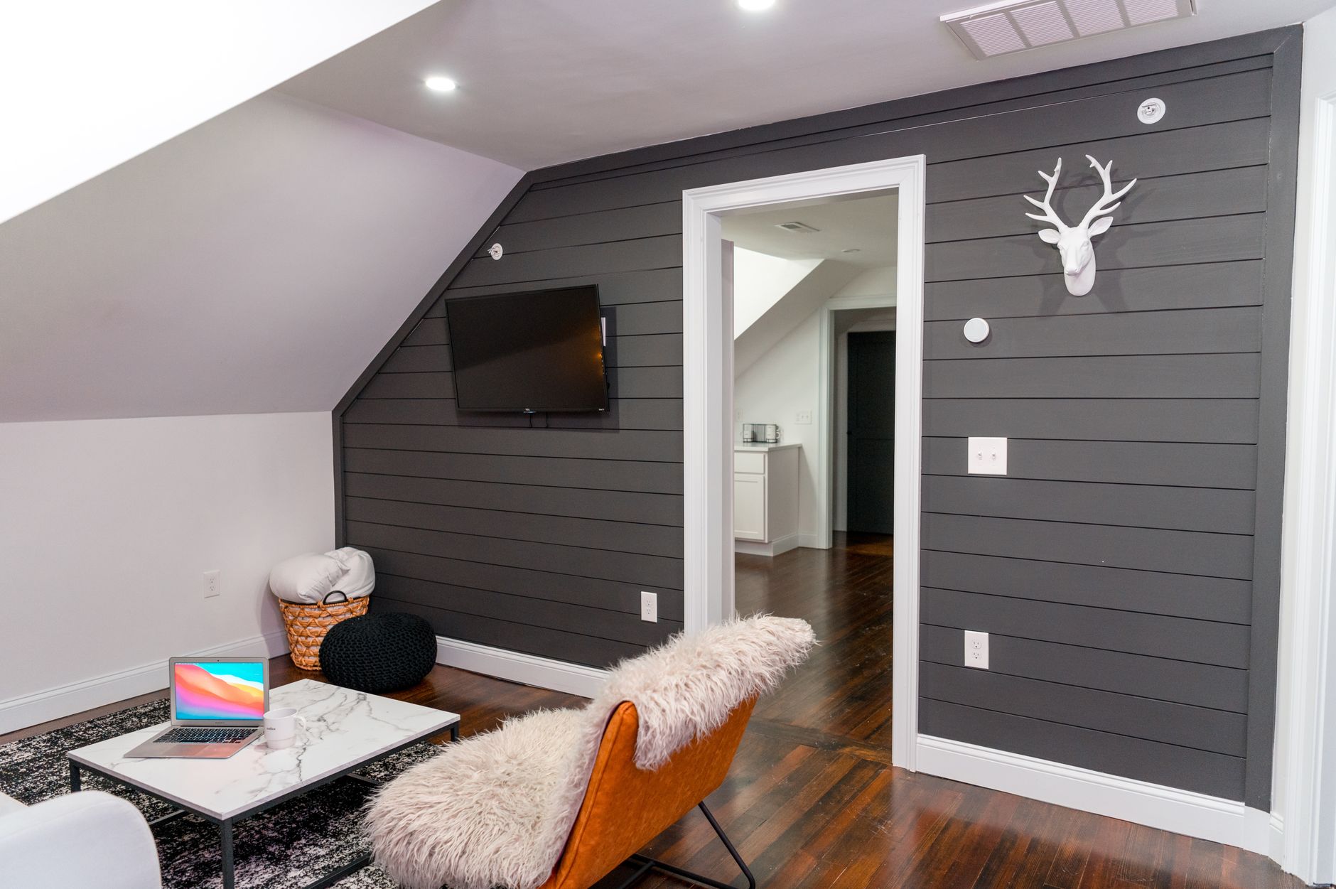 a battery-powered carbon monoxide detector mounted on a bedroom wall