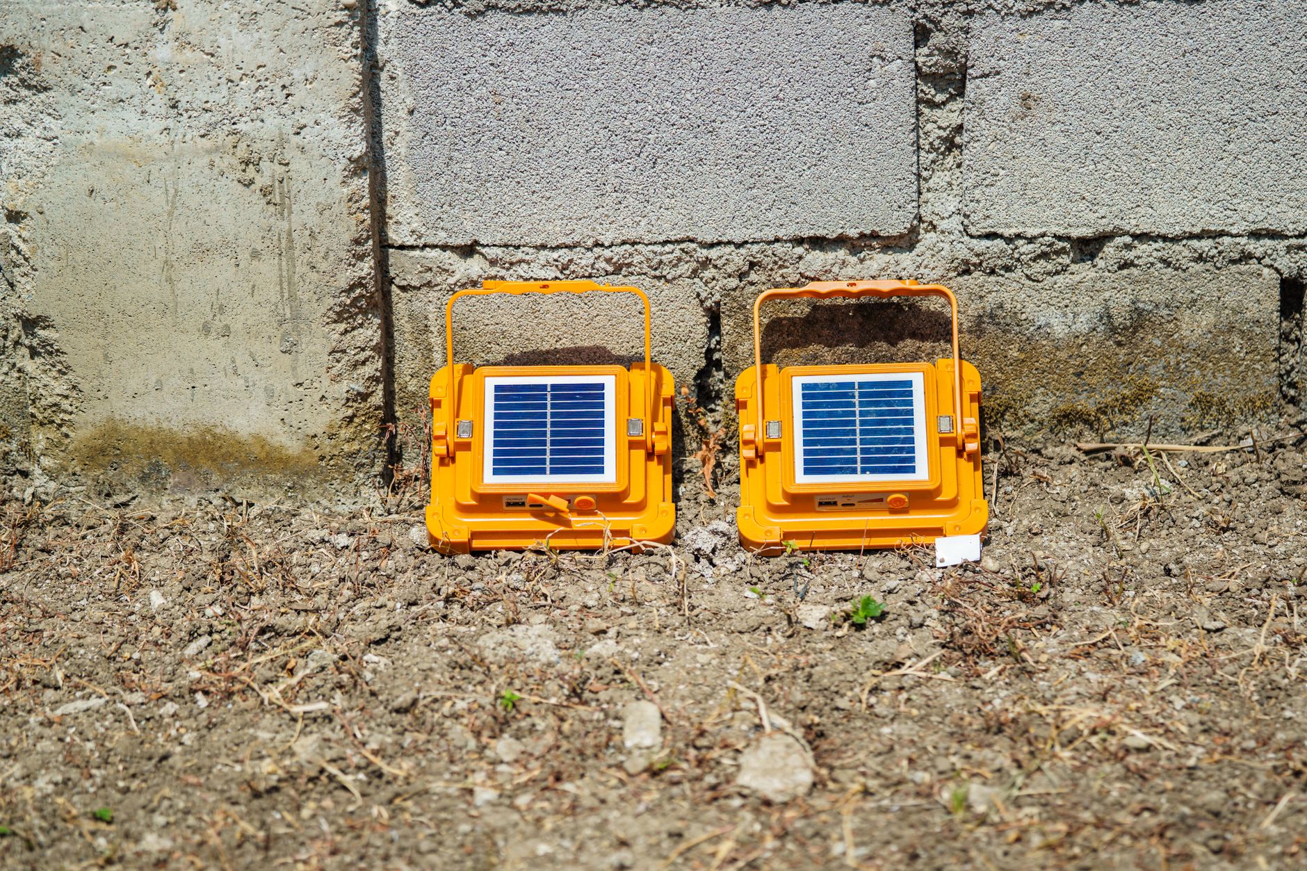 A portable generator placed outdoors at a safe distance from a house during a power outage