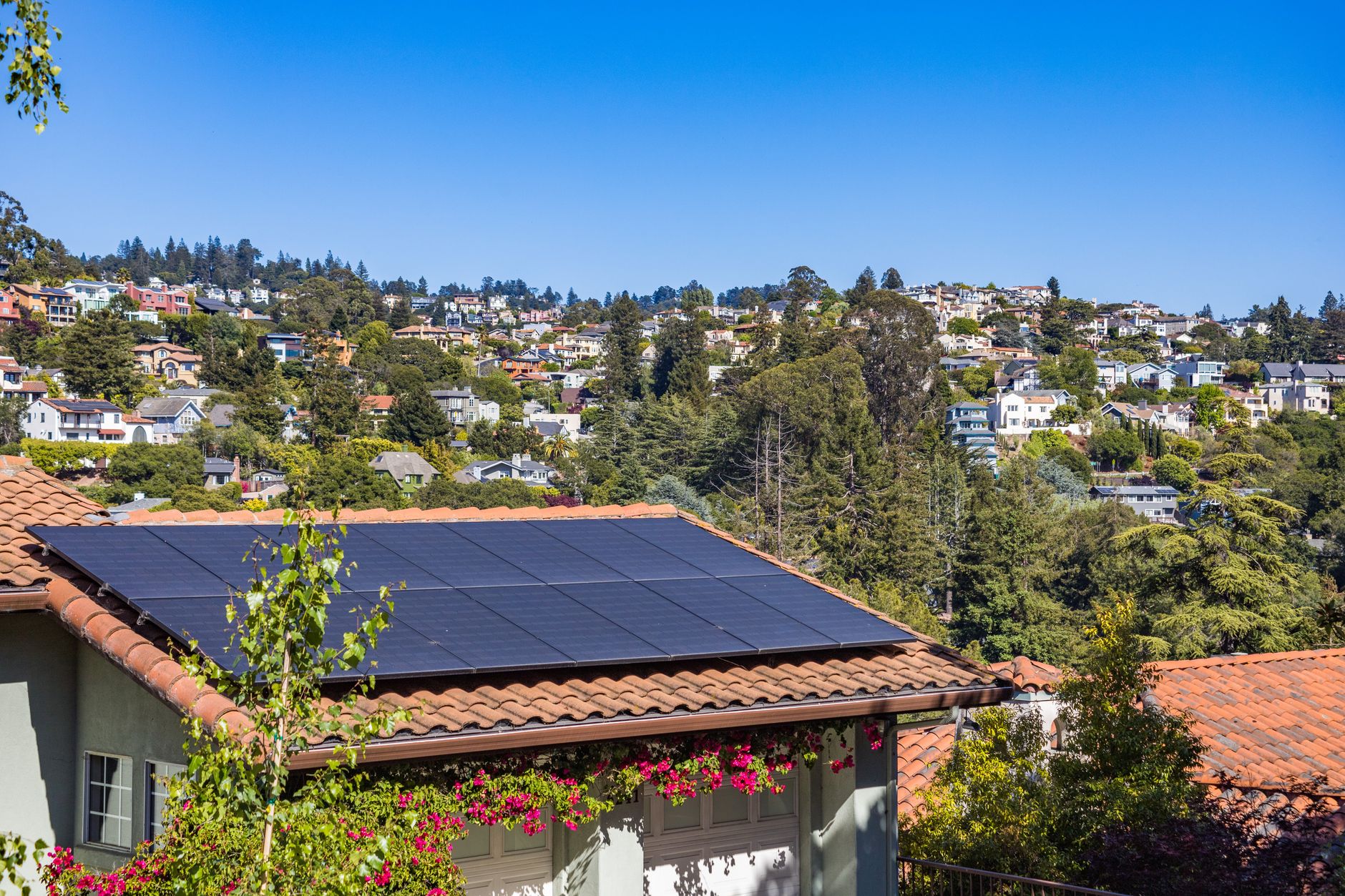 a small off-grid tiny house with solar panels on the roof