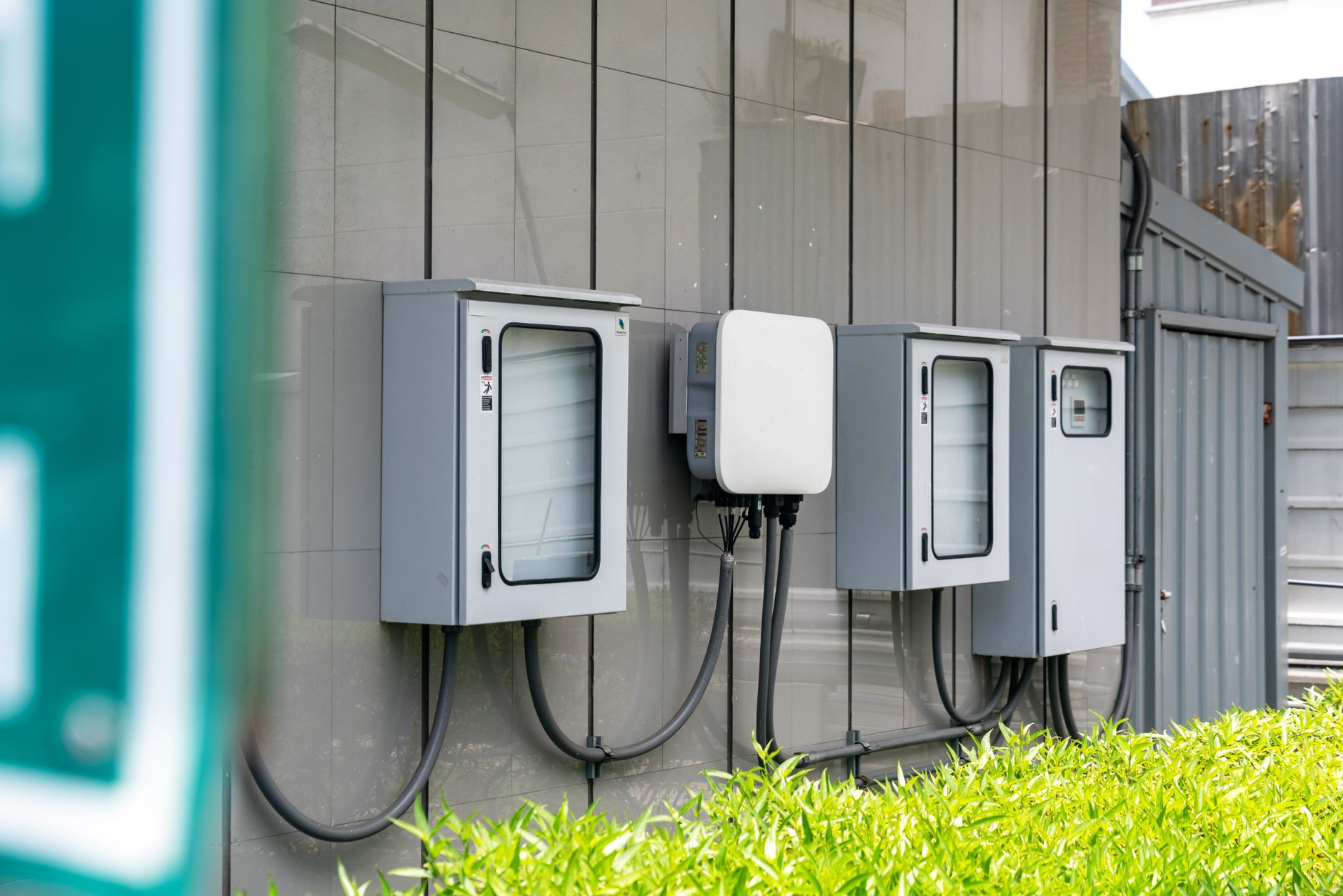 Enphase IQ Battery mounted beside a residential electrical panel